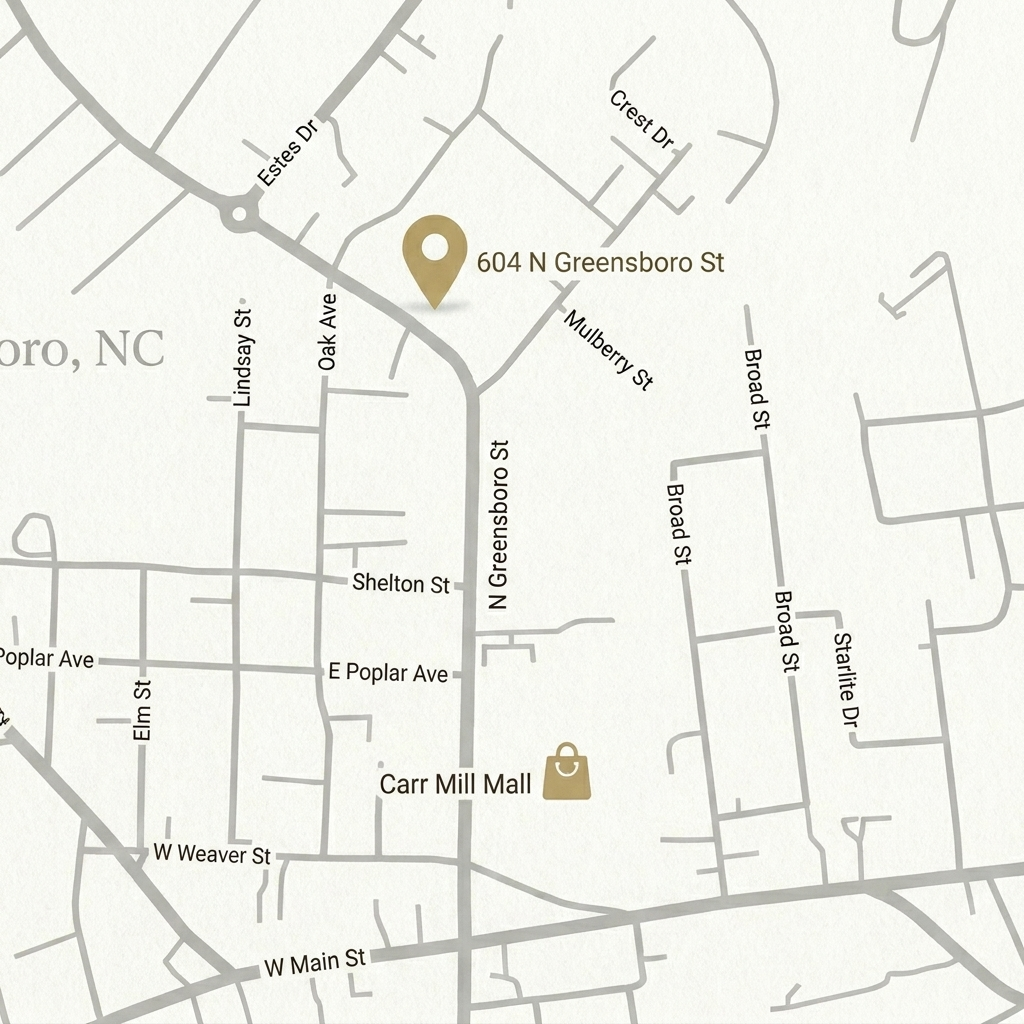Minimalist architectural neighborhood map of Carrboro, NC, showing 604 N Greensboro St and local landmarks.